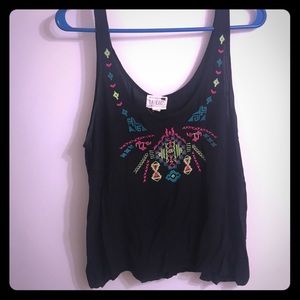 Black somewhat cropped tank with embroidered front